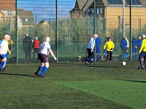 Who is the Boy in the Hat playing with the over70s ? 